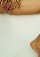 ATK Exotics: Delice (Black model Delice pees in the shower)